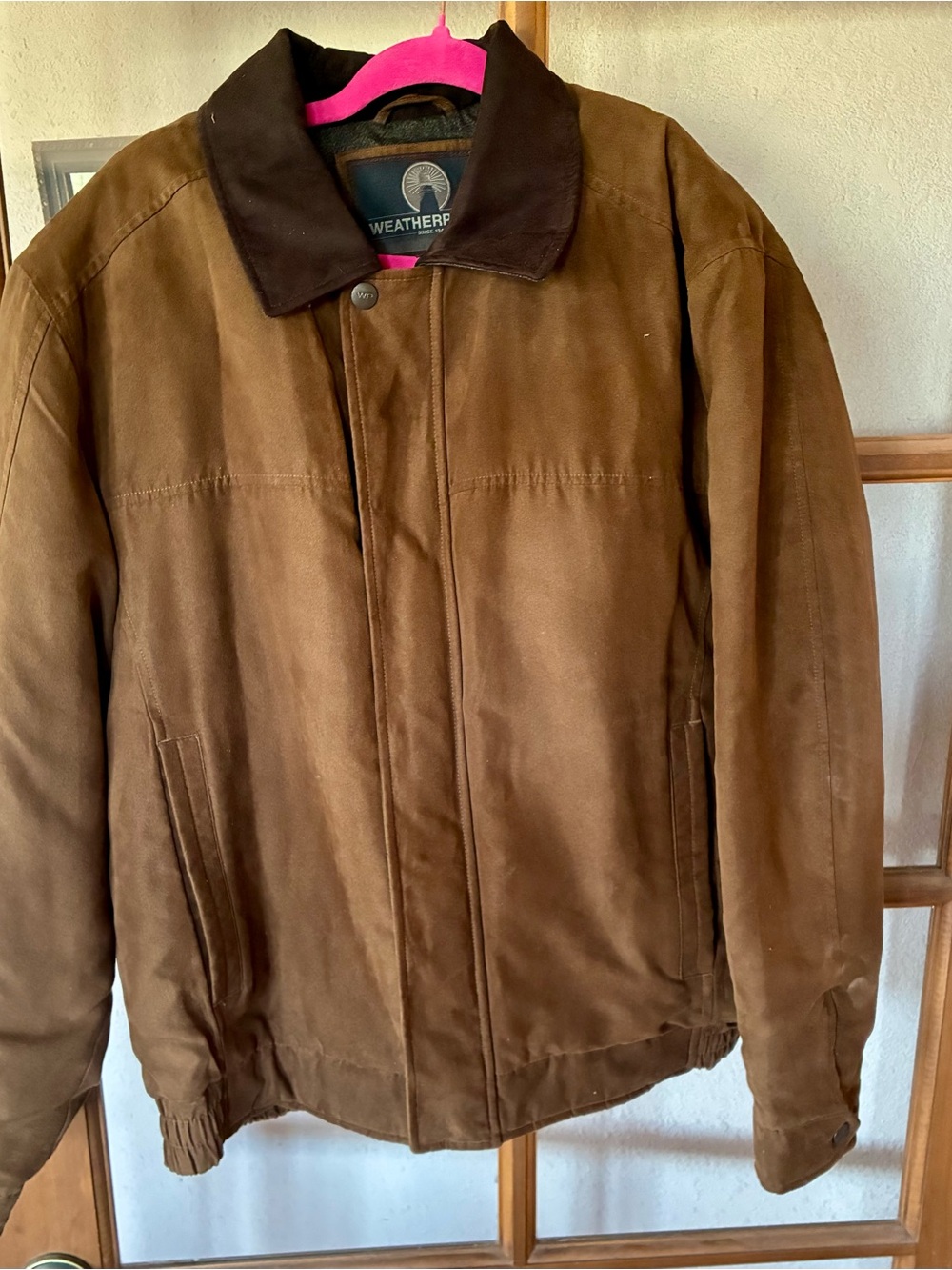 Women's rugged fax suede bomber style jacket.  Water proof polyester.